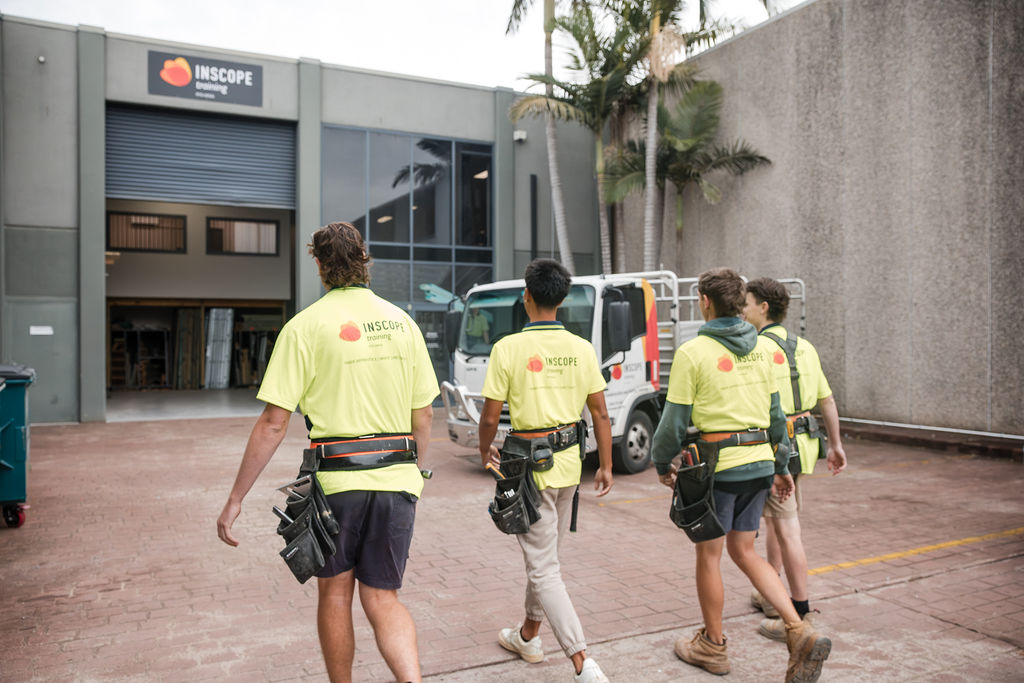 Students entering a trade training facility